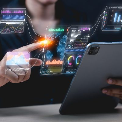 Businessman,Interacts,With,Digital,Financial,Analytics,And,Data,Visualizations,On